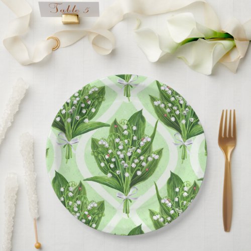 Bouquet of lilly of the valley flowers on green paper plates
