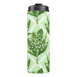 Bouquet of lilly of the valley flowers on green thermal tumbler