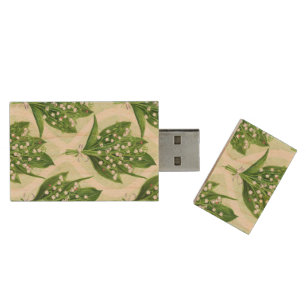 Bouquet of lilly of the valley flowers on green wood flash drive