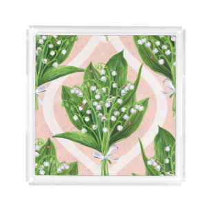 Bouquet of lilly of the valley flowers on pink acrylic tray