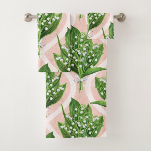 Bouquet of lilly of the valley flowers on pink bath towel set