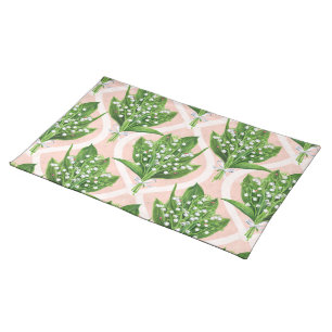 Bouquet of lilly of the valley flowers on pink cloth placemat