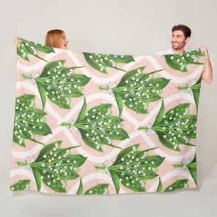 Bouquet of lilly of the valley flowers on pink fleece blanket
