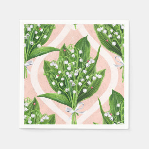 Bouquet of lilly of the valley flowers on pink napkins