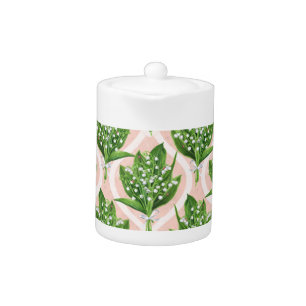 Bouquet of lilly of the valley flowers on pink teapot