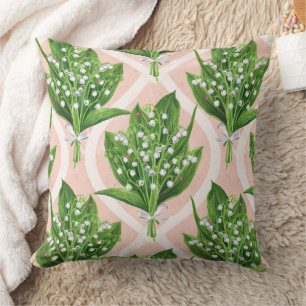 Bouquet of lilly of the valley flowers on pink throw pillow