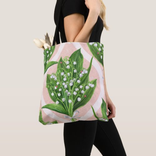 Bouquet of lilly of the valley flowers on pink tote bag