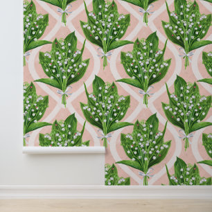 Bouquet of lilly of the valley flowers on pink wallpaper 