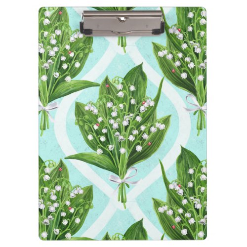 Bouquet of lily of the valley flowers on blue clipboard