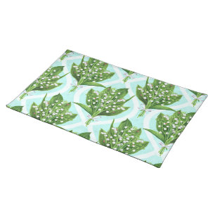 Bouquet of lily of the valley flowers on blue cloth placemat