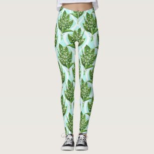 Bouquet of lily of the valley flowers on blue leggings