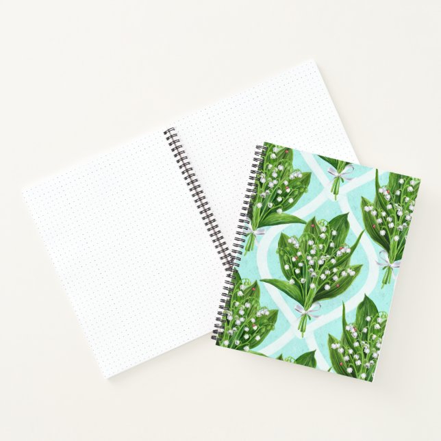 Bouquet of lily of the valley flowers on blue notebook (Inside)