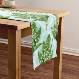 Bouquet of lily of the valley flowers on blue short table runner