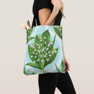 Bouquet of lily of the valley flowers on blue tote bag