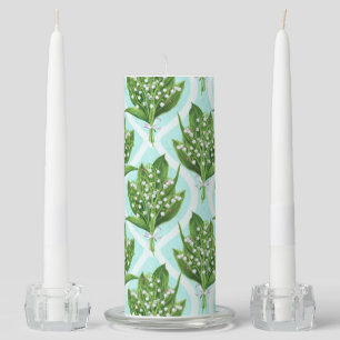 Bouquet of lily of the valley flowers on blue unity candle set