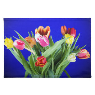 Bouquet of tulips on blue cloth placemat