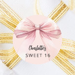 Bow pink Sweet 16 Classic Round Sticker<br><div class="desc">A blush pink colored background. Decorated with a large bow.  Personalize and add a name. Black handwritten style script.</div>