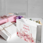 Bow She's tying the knot pink floral Bridal Shower Large Gift Bag<br><div class="desc">A white background decorated with a pink colored bow and pink roses,  flowers. Personalize and add a name
Text: She's tying the knot.</div>