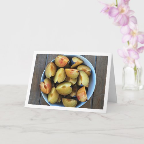 Bowl of Sliced Plum Fruit on Wooden Table Card