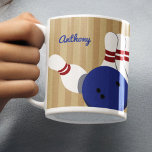 Bowling Ball and Pins Personalized Coffee Mug<br><div class="desc">Create a personalized gift for your favorite bowler when you add their name to this coffee mug. Realistic style illustrations of bowling pins and blue bowling ball are set against a tan striped background with a spot to add a name in blue script lettering. The name and graphic appear on...</div>