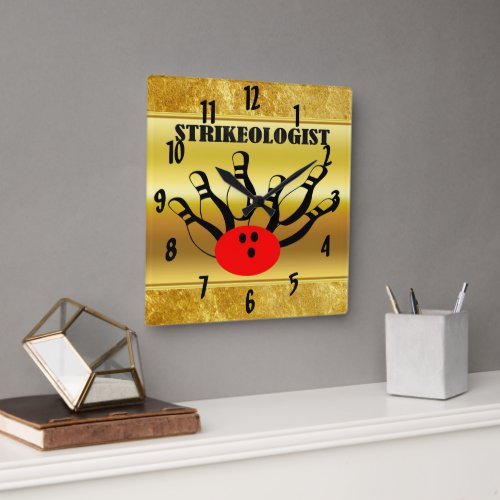 Bowling ball and pins with the word STRIKEOLOGIST Square Wall Clock