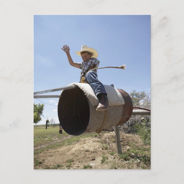 Boy (8-10) riding makeshift rodeo bull postcard (Front)