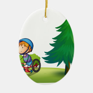 Boy and bike ceramic ornament