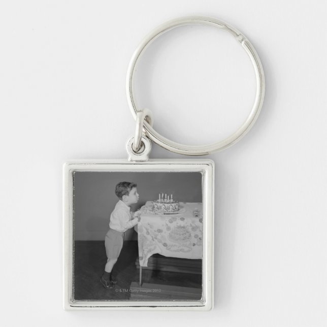 Boy Blowing Out Candles Keychain (Front)