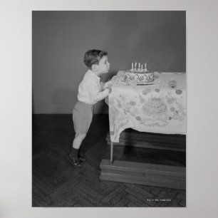 Boy Blowing Out Candles Poster