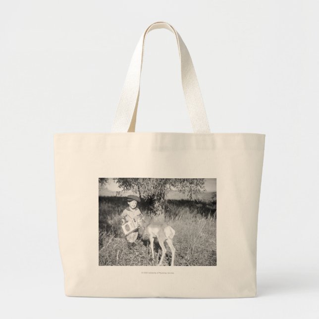 Boy feeding antelope by hand large tote bag (Front)