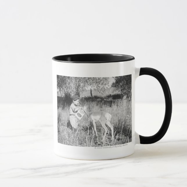 Boy feeding antelope mug (Right)