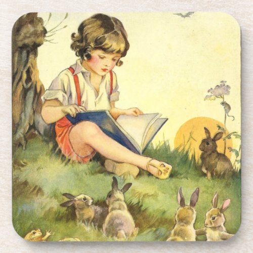 Boy reading under tree with rabbits beverage coaster
