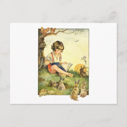Boy reading under tree with rabbits postcard