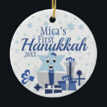 Boy | Star of David in Gifts First Hanukkah Photo Ceramic Ornament<br><div class="desc">The perfect way to commemorate a new bundle of joy's first holiday! An adorable design of a smiling Star of David proudly wearing a yarmulke or kippah, bursting through gifts. This design features a simplistic and traditional color scheme in silvers and blues. Don't forget to change the custom photo and...</div>