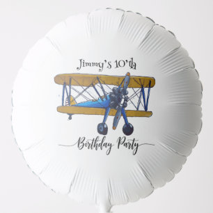Boys birthday party with blue and yellow biplane balloon