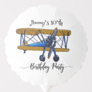 Boys birthday party with blue and yellow biplane balloon