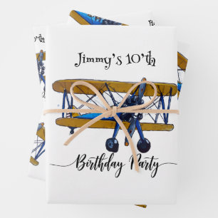 Boys birthday party with blue and yellow biplane wrapping paper sheets