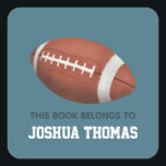 Boys Blue This Book Belongs Football Kids Square Sticker<br><div class="desc">This cute boy's 'this book belongs' bookplate design features an American football,  and has place for you to add your kids name in lovely typography. Perfect for your child's back to school supplies. Check out the rest of our collection for other cute sports themed kids items.</div>