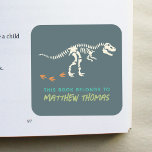Boys Blue This Book Belongs T-Rex Dinosaur Kids Square Sticker<br><div class="desc">This cool boy's 'this book belongs' bookplate design features a t-Rex dinosaur fossil,  and has place for you to add your kids name in lovely typography. Perfect for your child's back to school supplies. Check out the rest of our collection for other cute kids items.</div>