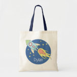 Boys Colorful Rocket Ship Space Galaxy and Name Tote Bag<br><div class="desc">This gorgeous kids tote bag features a beautiful and colorful hand drawn rocket ship in outer space. The design also features a place for you to add your boys name. Perfect for any toddler or child,  or for a new mom to use as a diaper bag!</div>