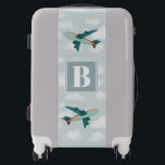 Boys Cute Blue Airplane Monogram Kids Luggage<br><div class="desc">This cute blue custom kids luggage design features a blue airplane illustration,  with a cloudy blue sky in the background. There is also space for you to add your boy's initials/monogram in a whimsical font—the perfect travel transport-themed gift for any aeroplane lover.</div>
