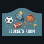 Boys Cute Blue Football Soccer Sports Kids Door Sign<br><div class="desc">This cute sports-themed boys door sign design features a basketball,  football,  tennis racket,  soccer ball,  and trophy,  and can be personalized with your boys name. Perfect for space or sports-loving children. Great decor for a kid's room,  play room,  or a baby nursery!</div>