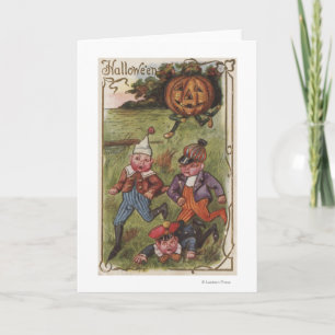 Boys Running From Pumpkin Man in Field Card