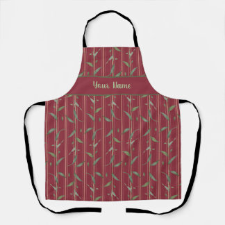 Branch of leaves on red wallpaper apron