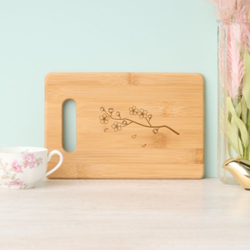 Branch with Blossoms and Petals Cutting Board