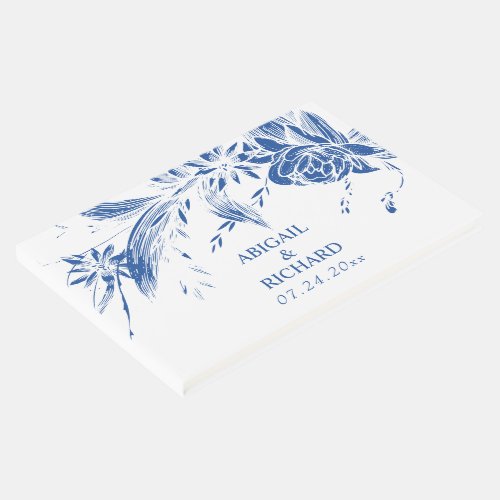 Branch with blue and white flowers wedding guest book