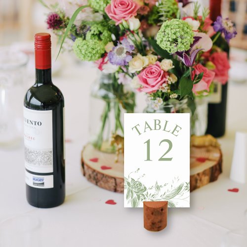 Branch with sage green and white flowers wedding table number