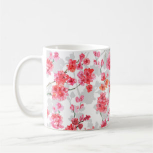 Branches of cherry blossoms on white and grey back coffee mug