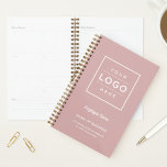 Branded Dusty Rose Business Weekly Planner<br><div class="desc">A chic dusty rose weekly planner designed for businesses to brand with their own custom logo, employee name, business name, slogan, location, and website. The soft pink tone paired with a clean framed logo placement and elegant script accents creates a feminine organizational tool for staff, clients, or corporate gifting. All...</div>