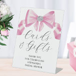 Bridal Shower Cards Gifts Pink Bow Glam Pedestal Sign<br><div class="desc">This bridal shower sign features a silky pink bow design with faux rhinestones and modern script typography. Personalize it with your text. Matching bridal shower products available.</div>